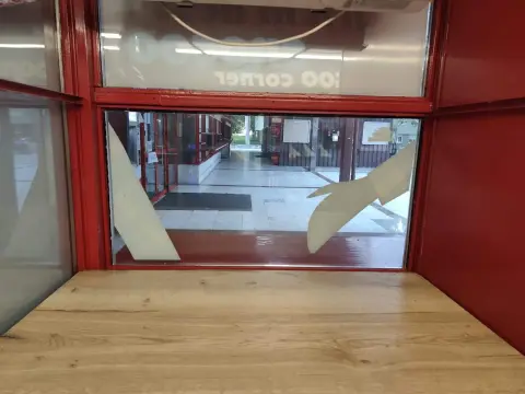 Franck — red service counter beside a window