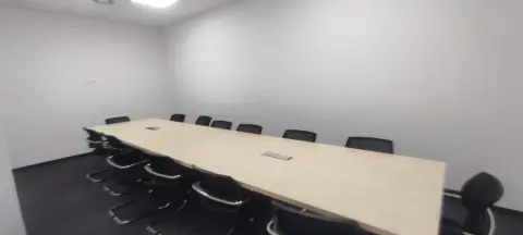 GLS — meeting room with a long table and chairs