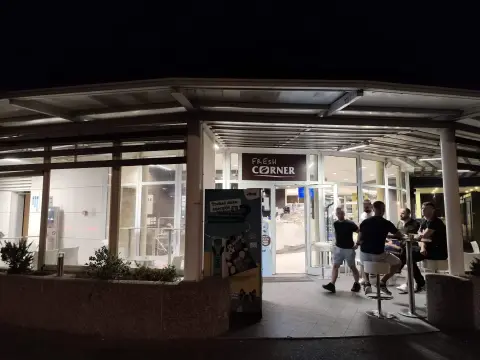 INA — petrol station shop entrance at night